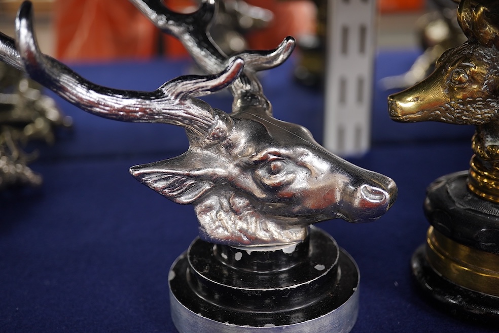 Five chrome and brass car radiator mascots; three in the form of stags’ heads, a stag standing on an oak branch and an Art Deco leading gazelle. Condition - fair, some losses to chrome plating.